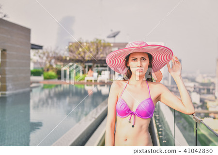 Swimsuit Concept. Beautiful girl wearing pink swimsuit. Beautifu Swimsuit Concept. Beautiful girl wearing pink swimsuit. Beautifu 41042830
