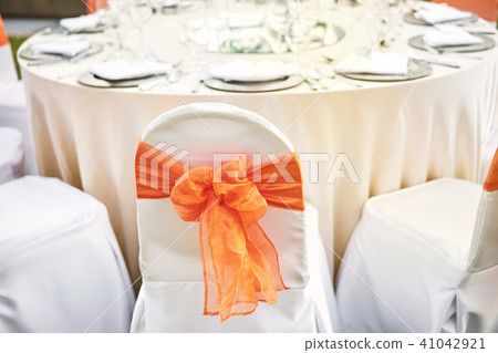 Spandex white cover chairs orange organza sash 41042921