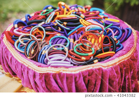 Colorful of bangles or embrace on the pink tray 41043382