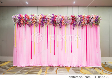 Beautiful backdrop in pink decorated with flower 41043420