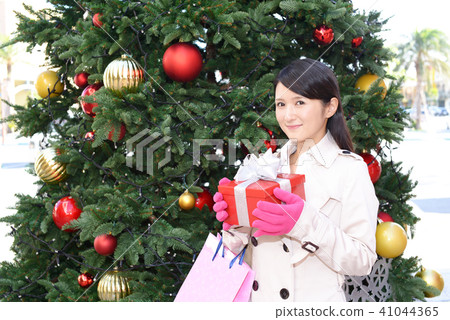 A woman with a present A woman with a present 41044365