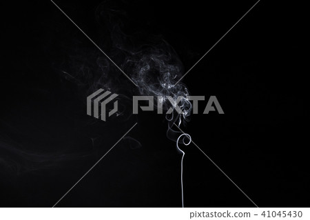 Vertical smoky swirl of burning aromastick Vertical smoky swirl of burning aromastick 41045430