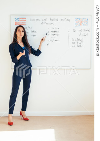 Young business woman in front of whiteboard Young business woman in front of whiteboard 41046977