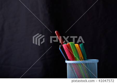 Color Magic in a metal box on a black background. 41047572
