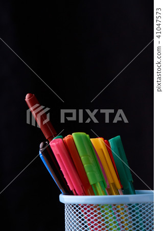 Color Magic in a metal box on a black background. Color Magic in a metal box on a black background. 41047573
