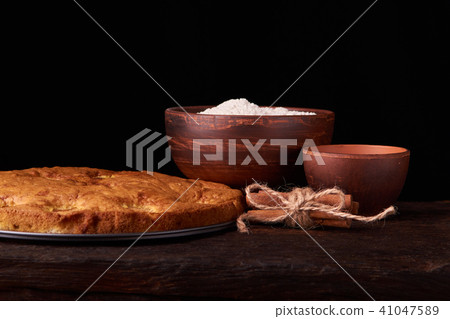 On a dark wooden table american apricot pie 41047589