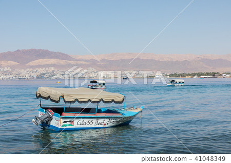 Touristic ships on the beach of Aqaba, Jordan. Pop 41048349
