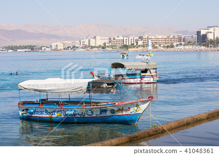 Touristic ships on the beach of Aqaba, Jordan. Pop 41048361