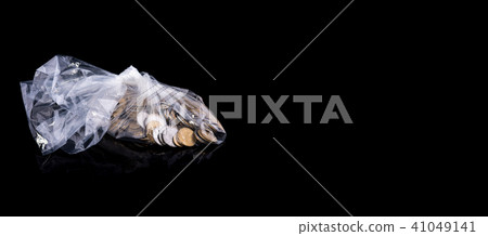 Idea - savings. Coins in a polyethylene package 41049141