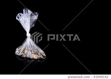 Group of coins in a polyethylene package, isolated 41049142