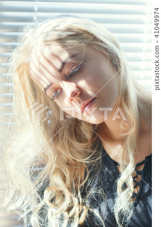 sad blonde woman sad blonde woman 41049974