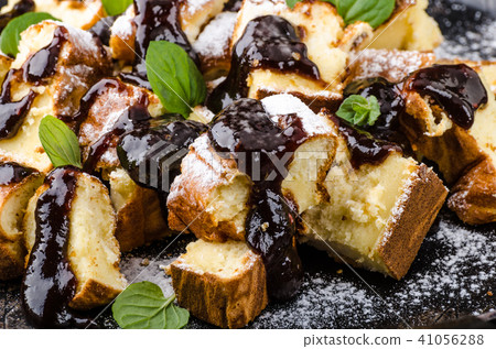 Cutted pancakes, Kaiserschmarrn delish dessert with plums Cutted pancakes, Kaiserschmarrn delish dessert with plums 41056288