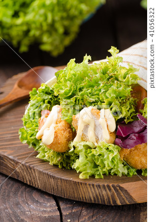 Grilled tortilla with chicken, mayo and tomato ketchu....Grilled tortilla chicken, lettuce, homemade mayo and barbeque sauce Grilled tortilla with chicken, mayo and tomato ketchu....Grilled tortilla chicken, lettuce, homemade mayo and barbeque sauce 41056322