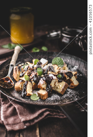 Cutted pancakes, Kaiserschmarrn delish dessert with plums 41056573