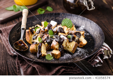 Cutted pancakes, Kaiserschmarrn delish dessert with plums 41056574