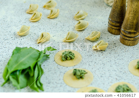 Making tortellini Making tortellini 41056617