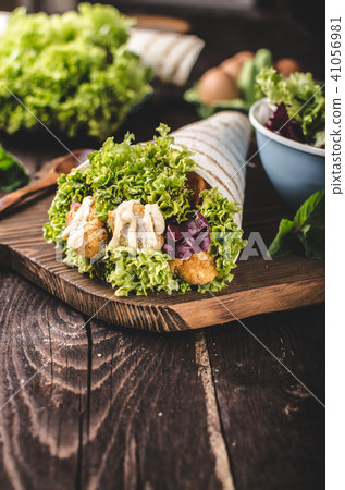 Grilled tortilla with chicken, mayo and tomato ketchu....Grilled tortilla chicken, lettuce, homemade mayo and barbeque sauce Grilled tortilla with chicken, mayo and tomato ketchu....Grilled tortilla chicken, lettuce, homemade mayo and barbeque sauce 41056981
