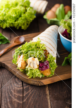 Grilled tortilla with chicken, mayo and tomato ketchu....Grilled tortilla chicken, lettuce, homemade mayo and barbeque sauce Grilled tortilla with chicken, mayo and tomato ketchu....Grilled tortilla chicken, lettuce, homemade mayo and barbeque sauce 41056987