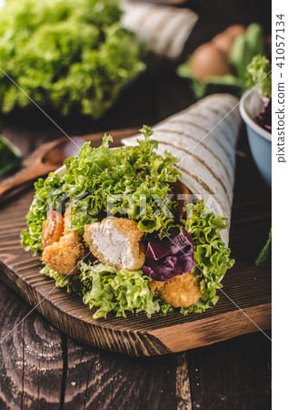 Grilled tortilla with chicken, mayo and tomato ketchu....Grilled tortilla chicken, lettuce, homemade mayo and barbeque sauce Grilled tortilla with chicken, mayo and tomato ketchu....Grilled tortilla chicken, lettuce, homemade mayo and barbeque sauce 41057134