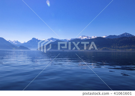 Blue sky and Alps seen from Lake Lucerne in Switzerland Blue sky and Alps seen from Lake Lucerne in Switzerland 41061601