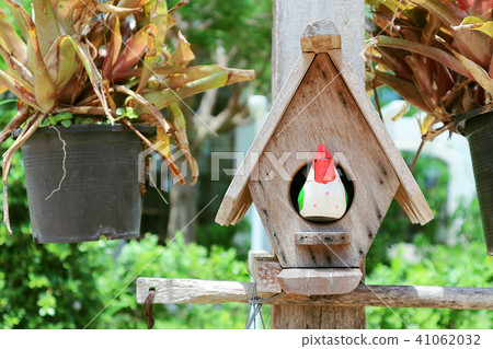 Cute bird's nest with blur tree background. Cute bird's nest with blur tree background. 41062032