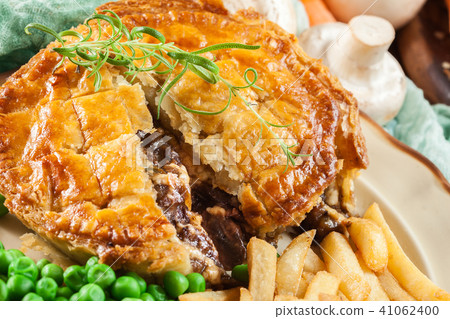 Homemade beef stew pie with french fries Homemade beef stew pie with french fries 41062400