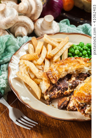 Homemade beef stew pie with french fries Homemade beef stew pie with french fries 41062403