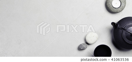 Asian tea set and spa stones on concrete background Asian tea set and spa stones on concrete background 41063536