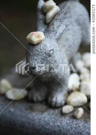 A stone statue of a rabbit shrine rabbit A stone statue of a rabbit shrine rabbit 41065173