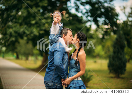 Family in green nature together Family in green nature together 41065823