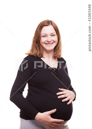 Smiling pregnant woman isolated over white background Smiling pregnant woman isolated over white background 41065846