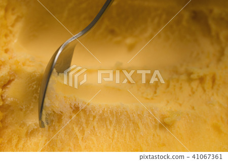 scooping with spoon orange sorbet scooping with spoon orange sorbet 41067361