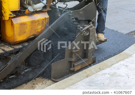 Workers making asphalt with shovels at road Workers making asphalt with shovels at road 41067607