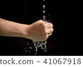 Woman's hands with water splash 41067918
