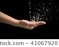 Woman's hands with water splash 41067920