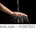 Woman's hands with water splash 41067921
