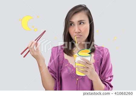 Asian woman hungry at night. Asian woman hungry at night. 41068260