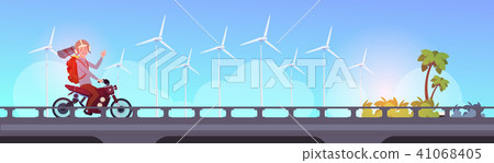 man tourist riding scooter or motorcycle with backpack over inter city landscape wind turbine energy 41068405