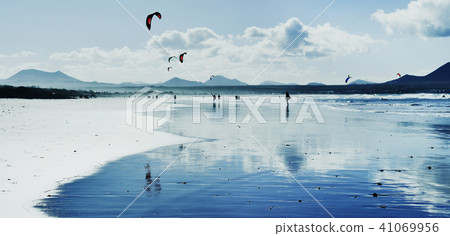 kitesurfers at Famara Beach in Lanzarote, Spain. 41069956