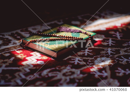 prayer beads on Koran holy book of Muslims 41070068