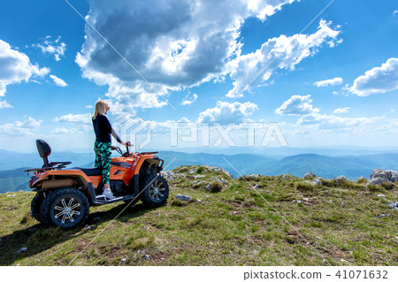 Friends driving off-road with quad bike or ATV and UTV vehicles 41071632