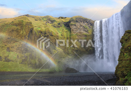 Skogafoss waterfall with rainbow in Iceland Skogafoss waterfall with rainbow in Iceland 41076183