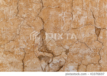 Brown adobe clay wall texture background. 41076697