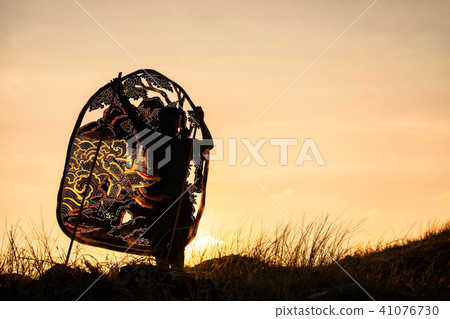 Silhouette man hold Thai shadow angel puppet Silhouette man hold Thai shadow angel puppet 41076730