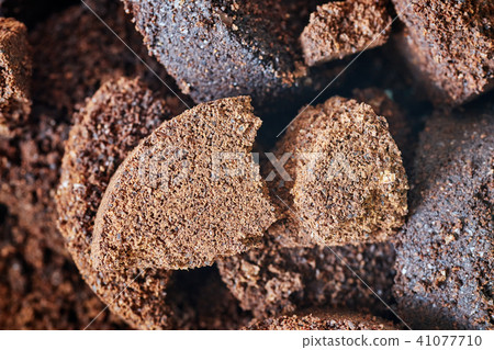 Close up picture of used coffee grounds. 41077710
