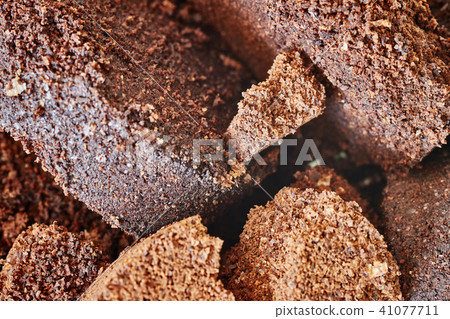 Close up picture of used coffee grounds. 41077711