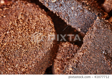 Close up picture of used coffee grounds. 41077712