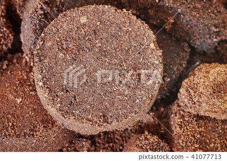 Close up picture of used coffee grounds. 41077713