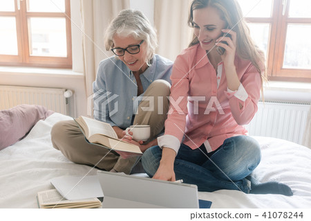 Mother and daughter leading the family business from home  41078244