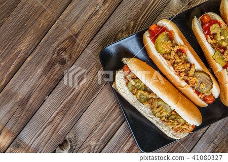 American hot dog with pickles,onions, ketchup and mustard American hot dog with pickles,onions, ketchup and mustard 41080327